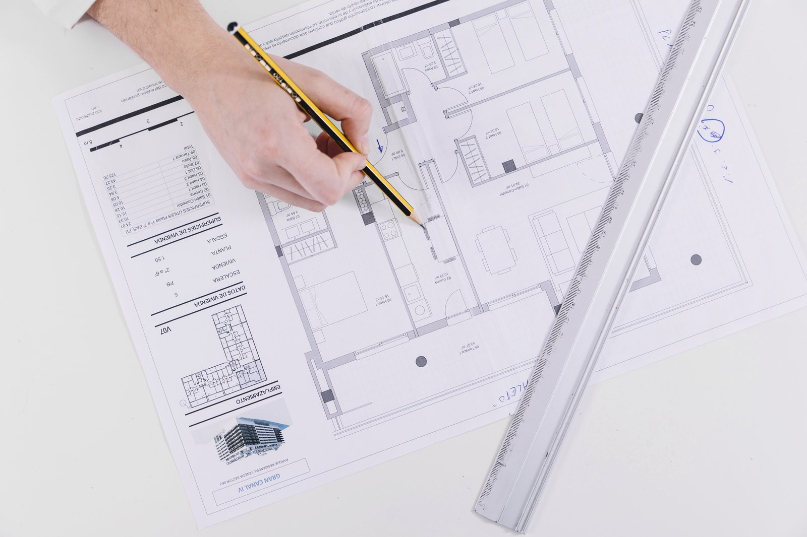 Architect reviewing technical blueprints for a London residential project