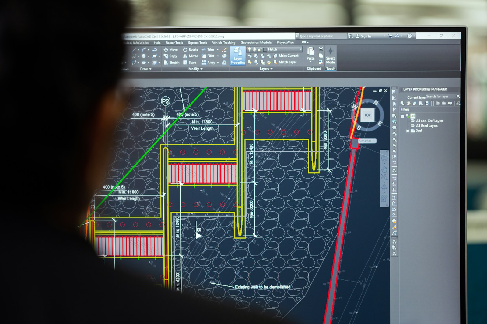 Chartered architectural technologist reviewing a planning application timeline for a London extension